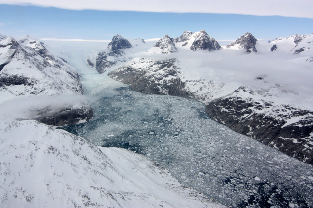 ice flow in between two rocky hillsides