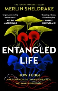 Entangled Life book cover showing three species of mushroom (close ups) in bright colours with the text Entangled Life in white between these.