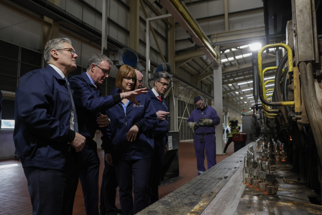 Keir Starmer and others looking at machinery in a carbon capture factory