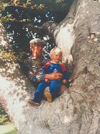 Merlin as a child high in the rainforest canopy, exploring with his father.